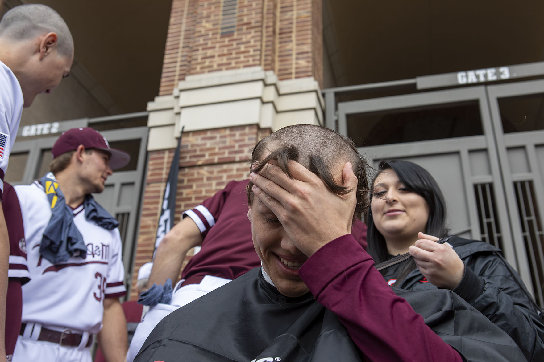 A&M baseball head shaving for cancer